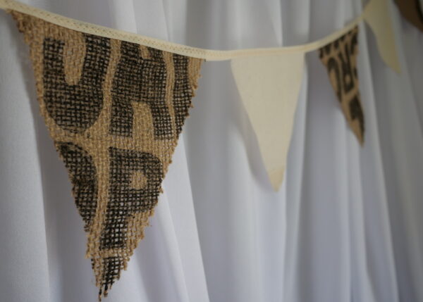 Image of hessian and canvas bag bunting - the hessian has coffee bag markings