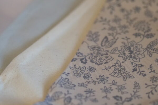 Alternating grey, cream and wildflower pattern triangle bunting