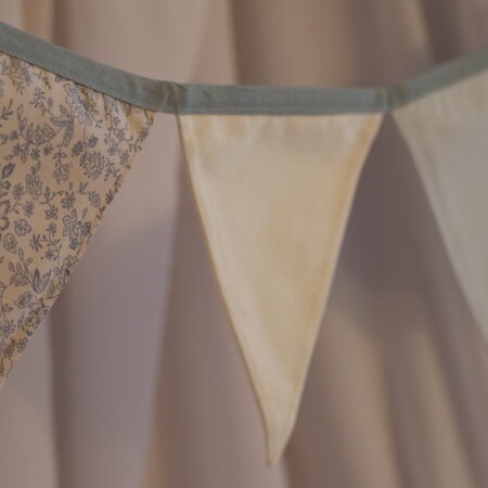Alternating grey, cream and wildflower pattern triangle bunting